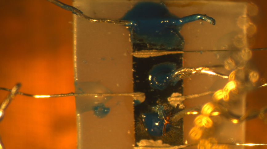A close-up of iron-based material, Ba1−xKxFe2As2, in lab set-up for experimental measurements.