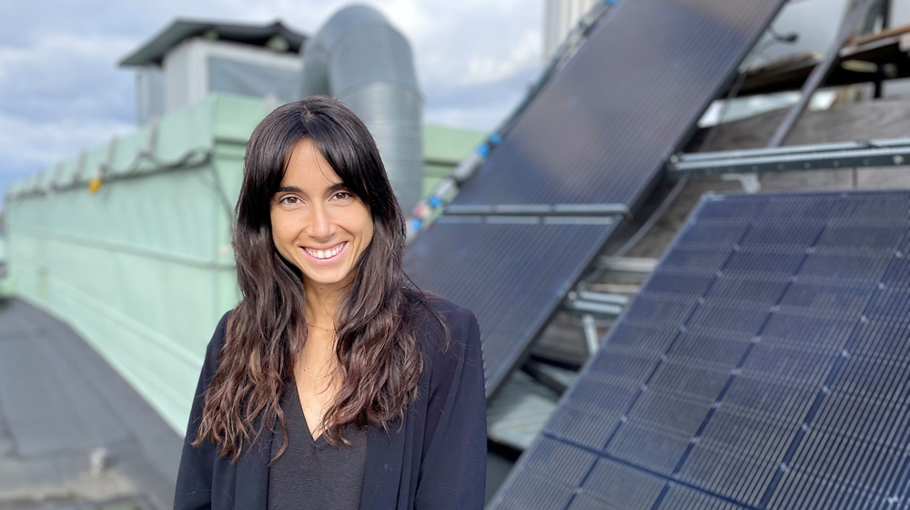 Woman in front of solar panels