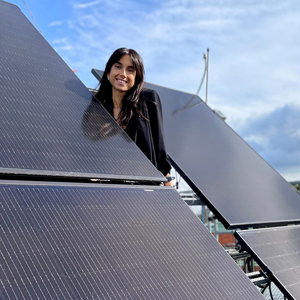 Woman near solar panels