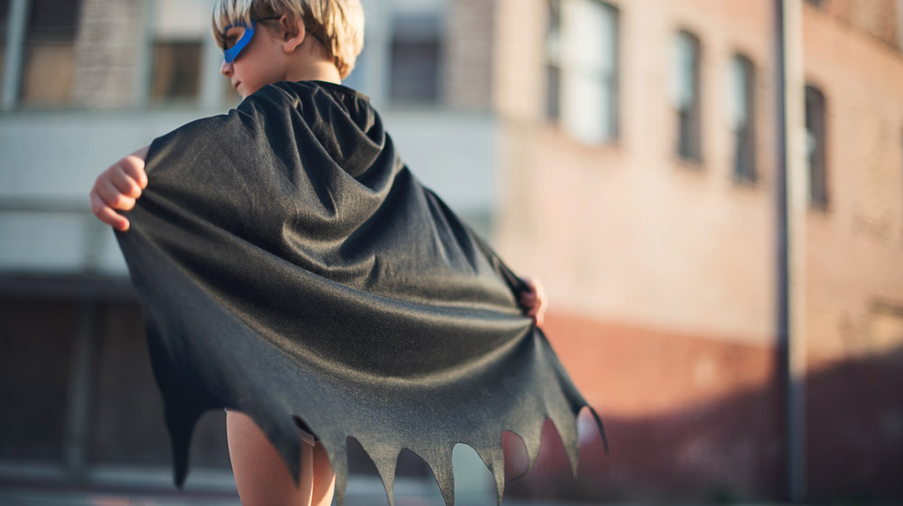 Child dressed as a superhero.