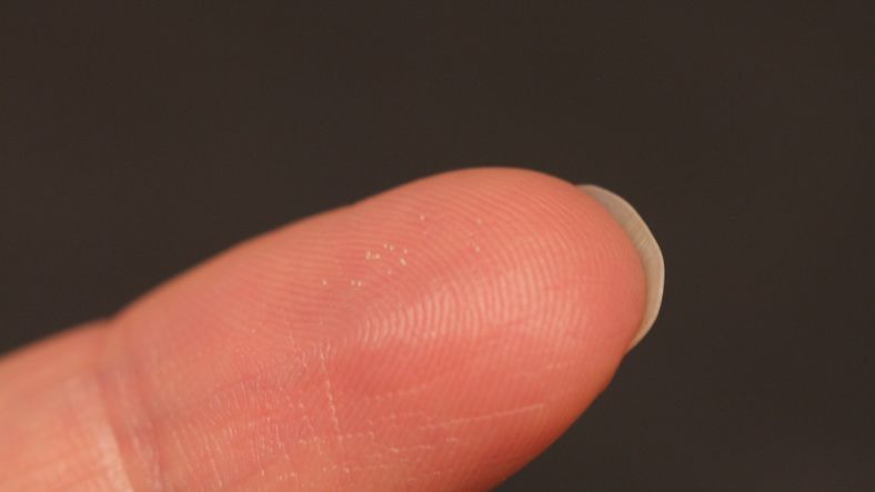 Microneedle Microdevices on a fingertip.