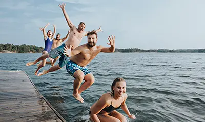 Students jumping in the water