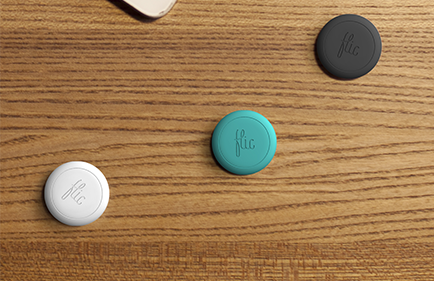 white green and black flic buttons on a table top
