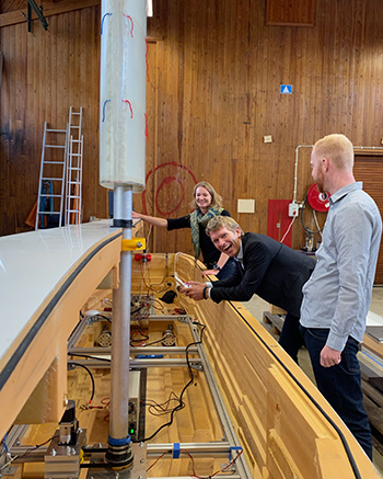 students working in the lab on a ship model