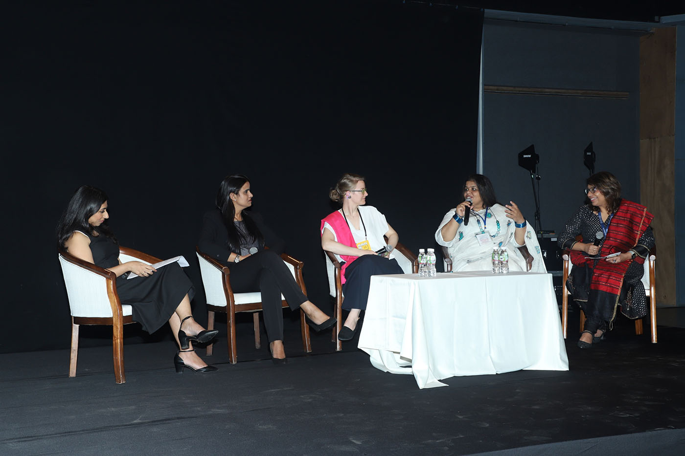 Five women sit on the stage and have a conversation during Tekla Dialogue.