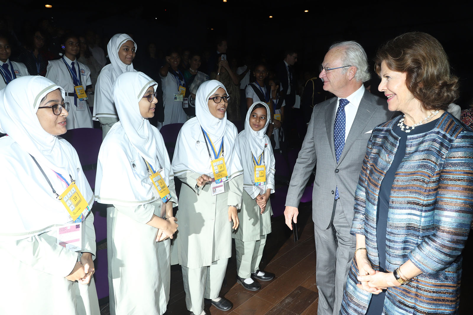 HM King Carl XVI Gustaf and HM Queen Silvia talks to four girls from the audience.