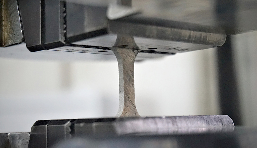 A piece of alloy is stress tested in a lab set-up. 