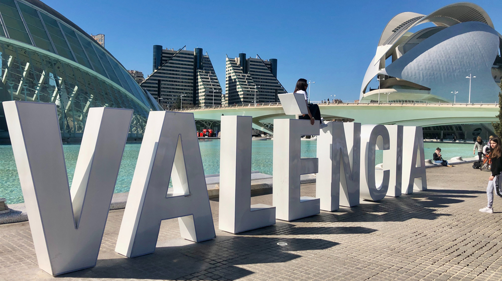 Sign "Valencia" from the city, a sunny day.