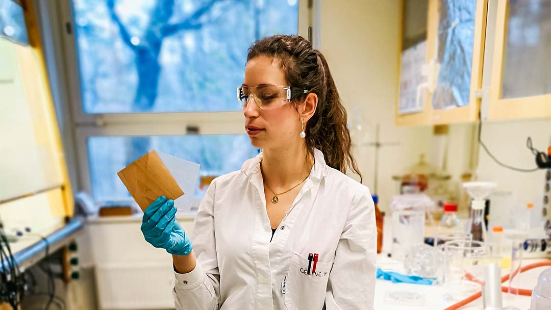 Woman in lab coat.