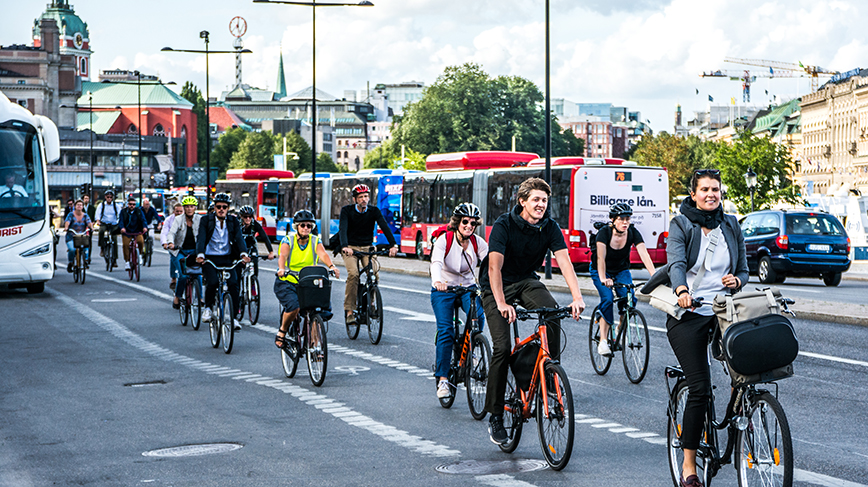 Bicycle commuters ride en masse on a Stockholm street 