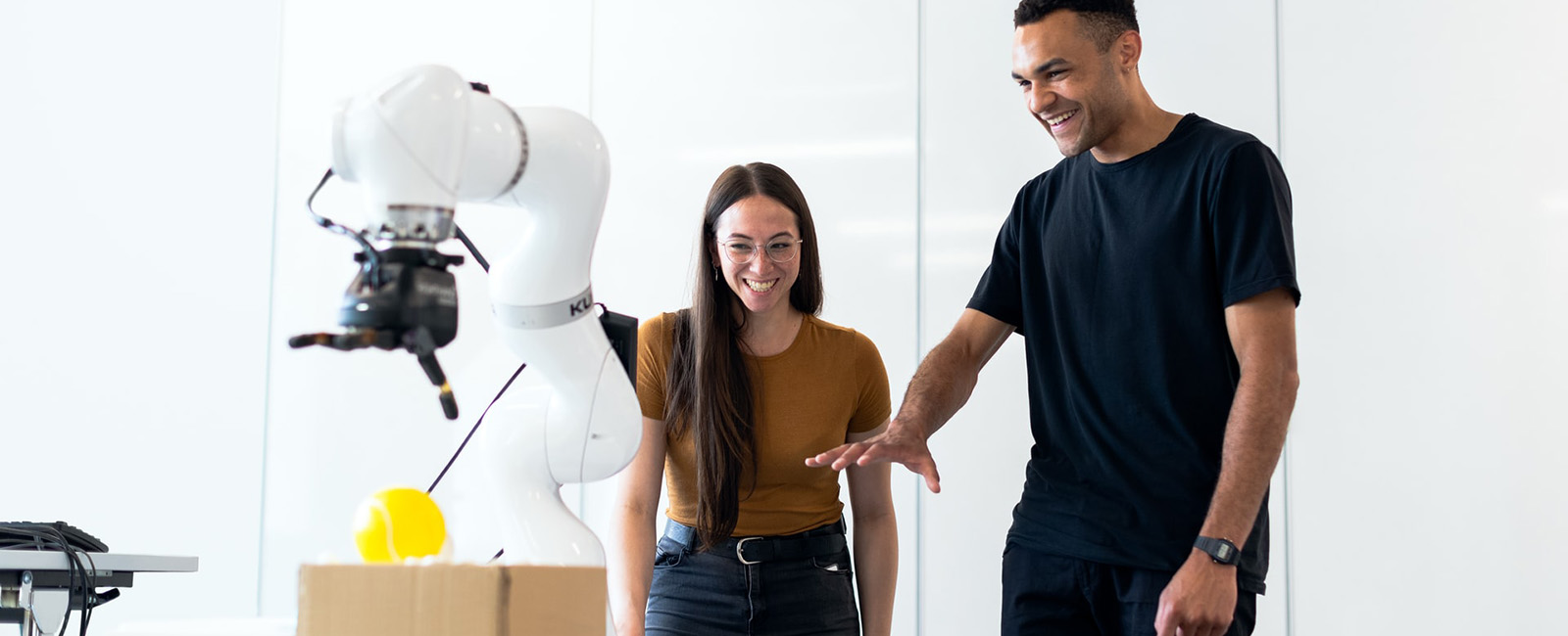 Man and woman with robot