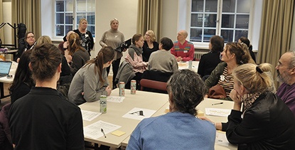 A group of people ina calssroom discussing