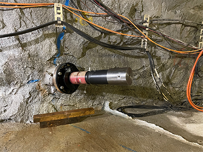 An injection tube with measuring equipment in bedrock in a tunnel