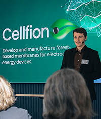 Liam Hardey holding a presentation about Cellfion on stage