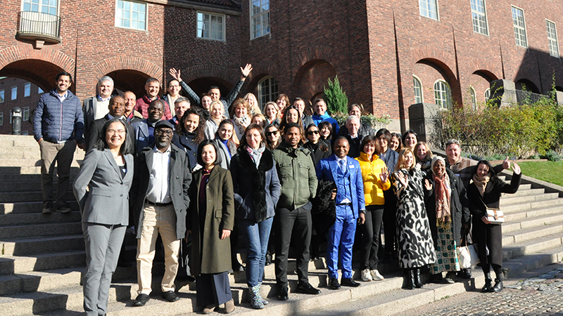 A group of people in front of the KTH building