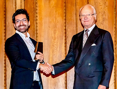 Ramtin Massoumzadeh shakes hands with the king