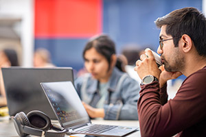 Two doctoral students participating in a workshop