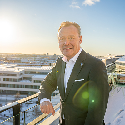 man smiling with city of Stockholm in background
