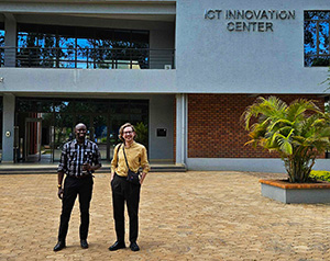 Two men in front of a building