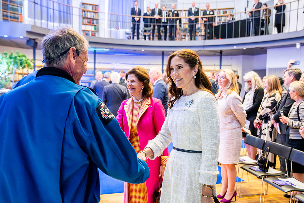 The Queen of Denmark greets astronaut Christer Fuglesang.