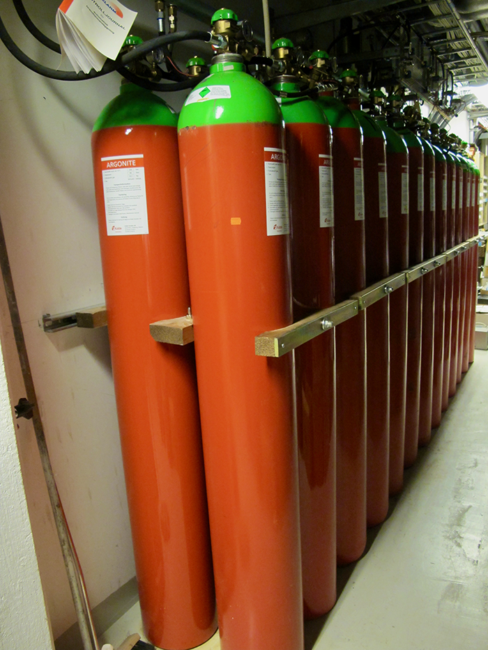 Rack of gas bottles containing fire suppressant argonite gas