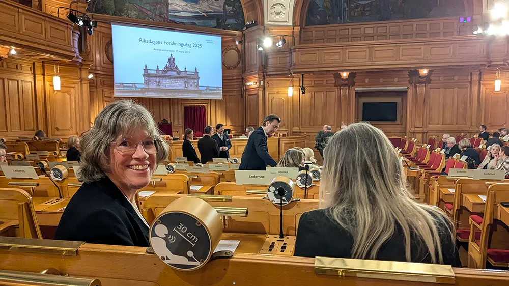 Woman smiling in the Riksdag