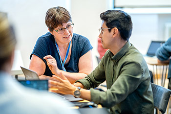 A librarian talking to a student.