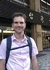 a man in a pink shirt