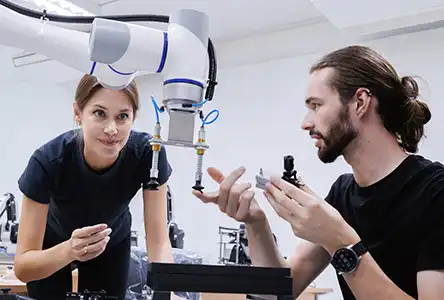 A woman and a man working as researchers in a lab.