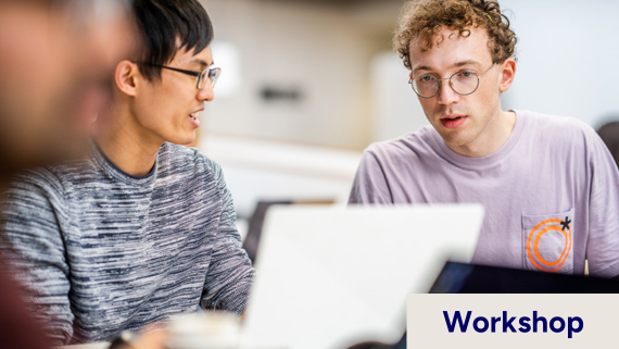 Two persons in front of a computer