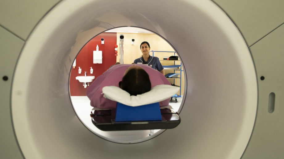 Person inside a radiation treatment machine.
