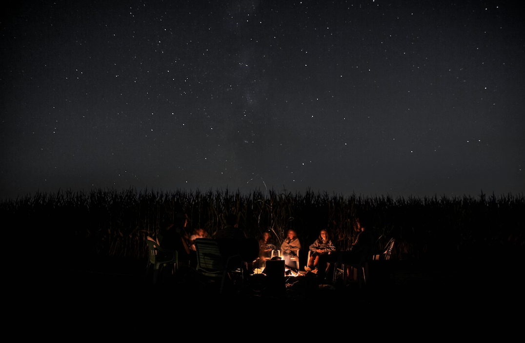 people around a fire for storytelling