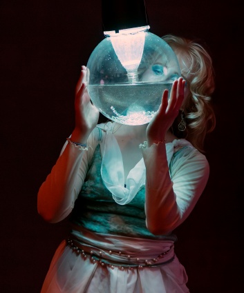 Hannah holding a glowing orb