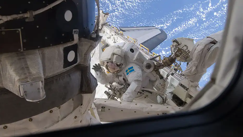 Man in spacecostume in space.