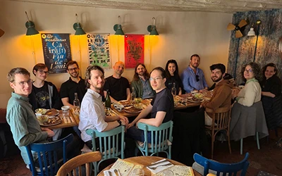 A group of people having dinner. 
