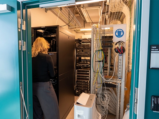 Student working in a server room
