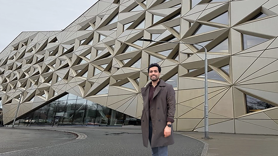 Man standing in front of building.