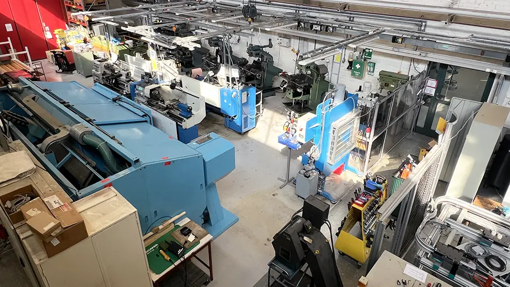 Interior of KTH Manufacturing Lab showing various mechanical equipment.