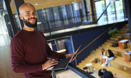 student with computer
