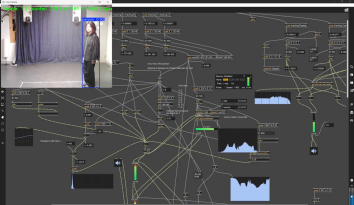 Screenshot of code in Max/MSP with a webcam window showing a person standing