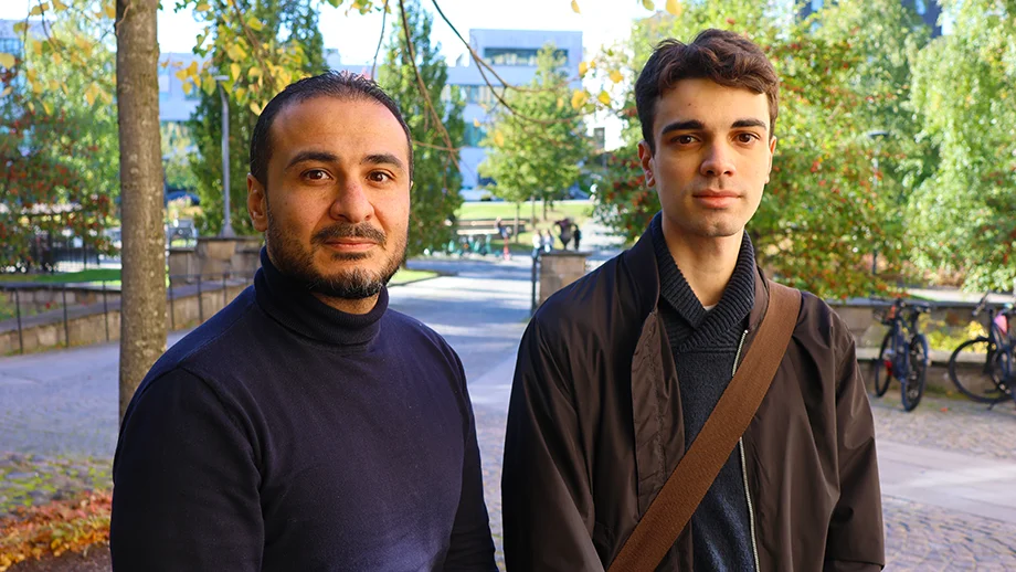 Two men standing outside