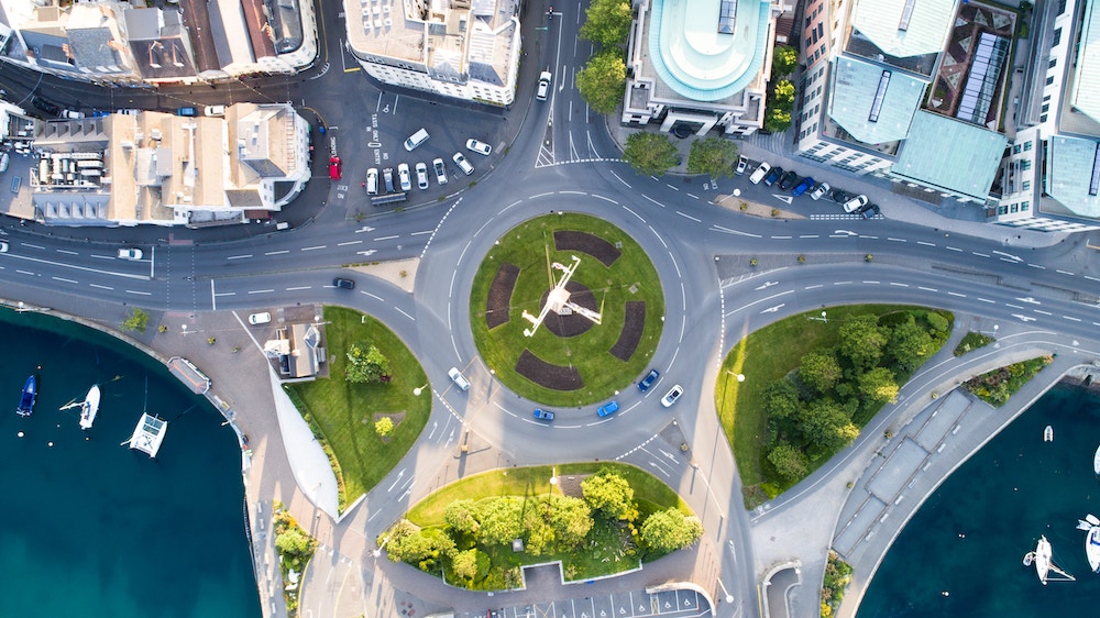picture of a roundabout in a coastal society from above.
